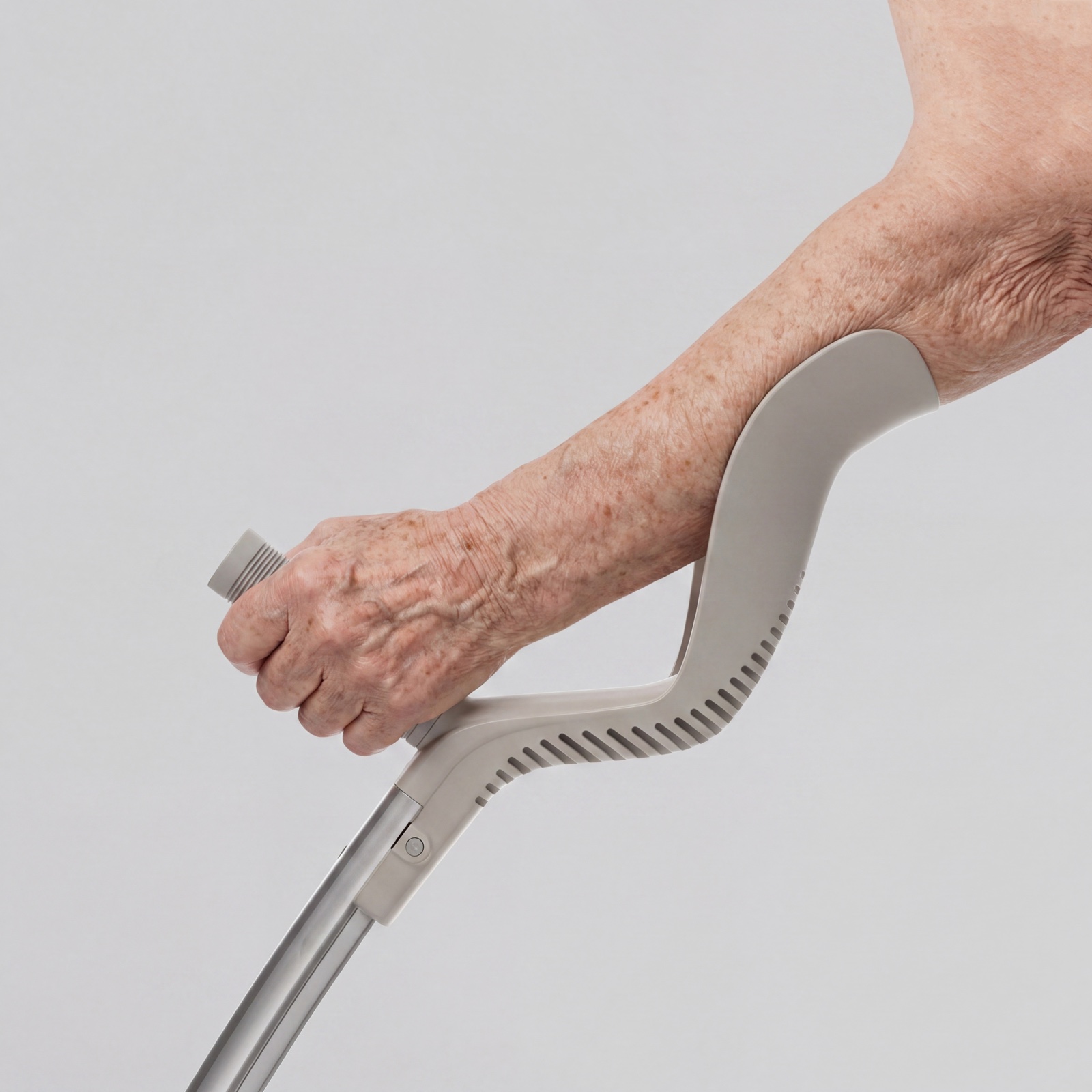 Close-up of a hand holding the walking aid’s contoured grip
